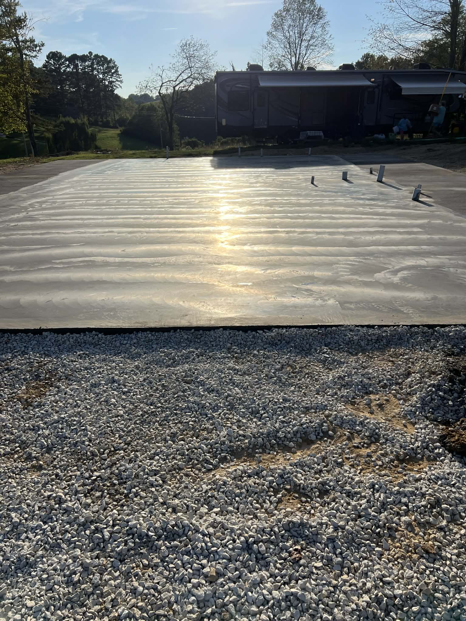 Wet concrete slab curing in sun